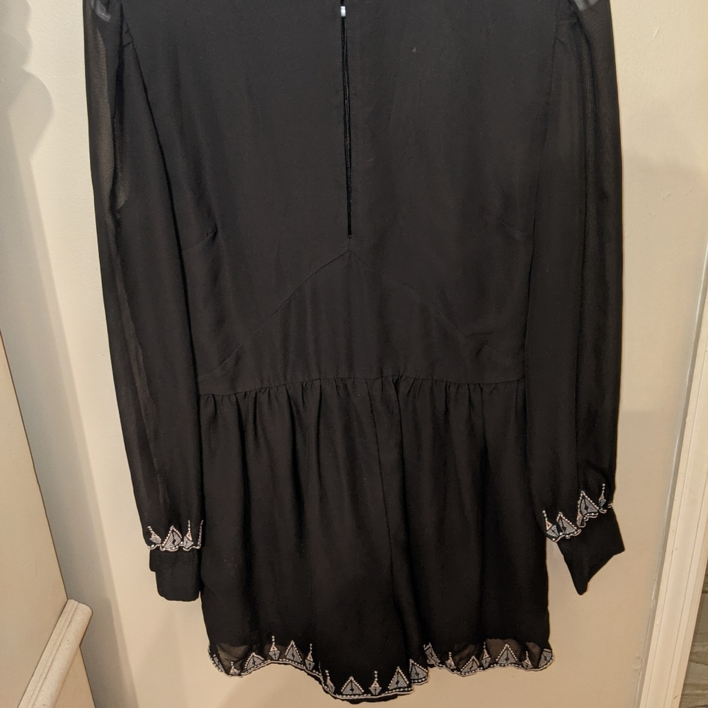 Super fun black House of Harlow  romper. L. Long sleeves with keyhole neckline.